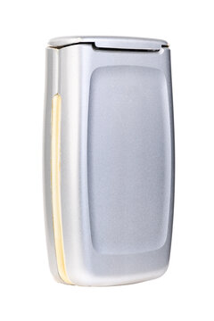 Old vintage closed silver flip mobile phone isolated on white background.