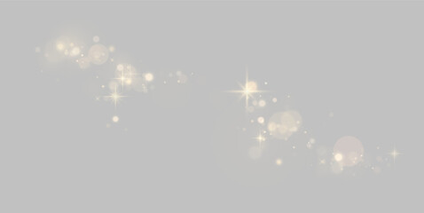 Curved trail of soft glowing gold bokeh lights and starbursts on a black background on transparent background © svetilo