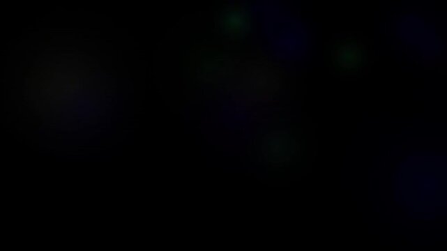 Seamless looping technology background with subtle glowing green and purple light effects fading in the darkness