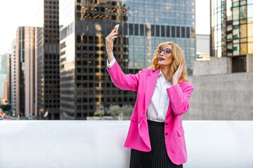 Fototapeta premium Transgender business woman lifestyle moments in downtown, Los angeles.