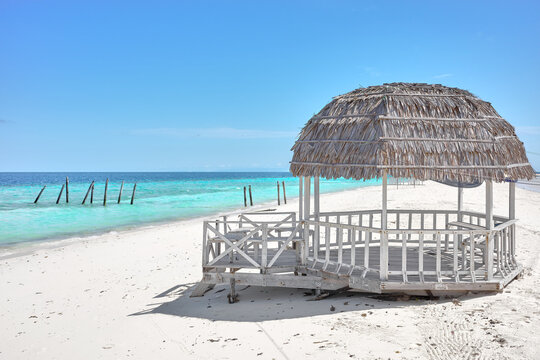 A wooden gazebo on a sandy beach on Timba Timba island, Semporna district, Borneo, Malaysia.