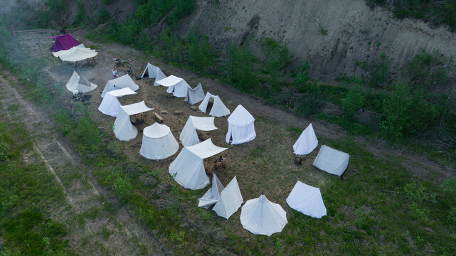 Aerial view of a medieval reenactment camp with tents human settlement role play game outdoor aerial view place