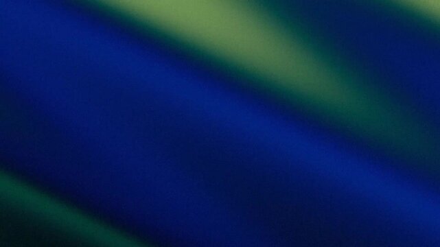 Abstract grainy background with blue and green diagonal gradient