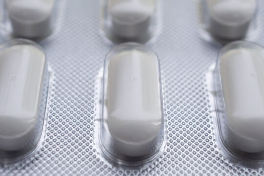 white medicine pills in blister pack close up