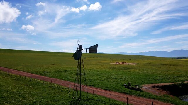 Old broken wind pump on a field in the Western Cape of South Africa