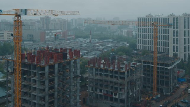 Timelapse of the constriction site of the living building in the city during rainy day