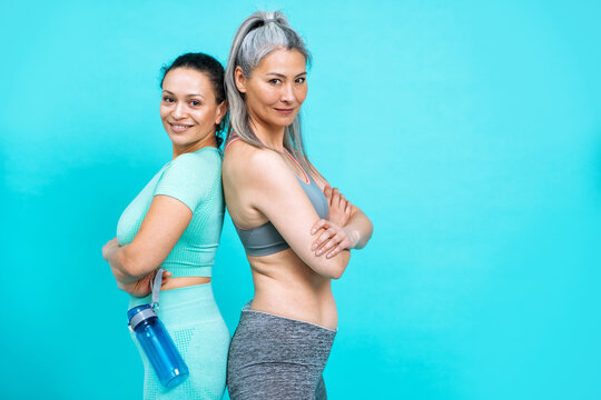 Image of two women with different body, age, and ethnicity making sport