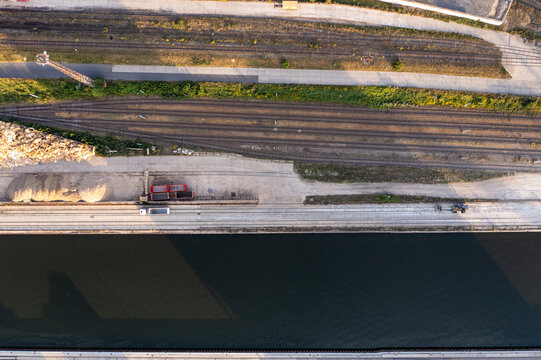 Aerial view of Container Terminal METRANS with railway tracks, a canal, and industrial infrastructure in Wildau, Brandenburg, Germany.