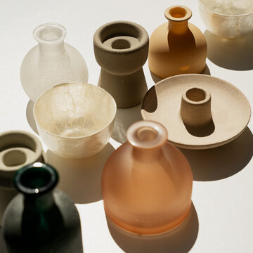 Top View Of Small Ceramic And Glass Vases In Natural Sunlight