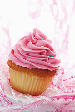 Close up of strawberry buttercream cupcake