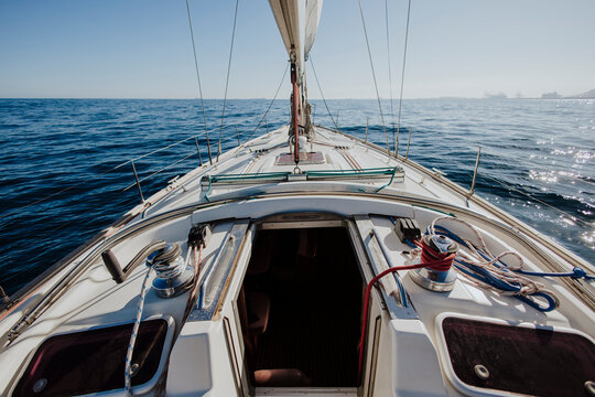 A sailboat deck overlooks the open sea during a nautical adventure