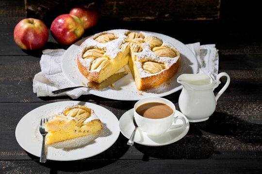 Home-baked apple pie and cup of white coffee