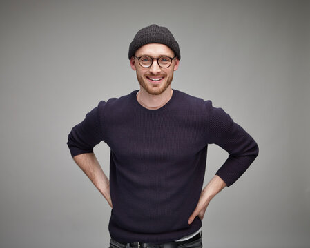 Portrait of man wearing wool cap and glasses