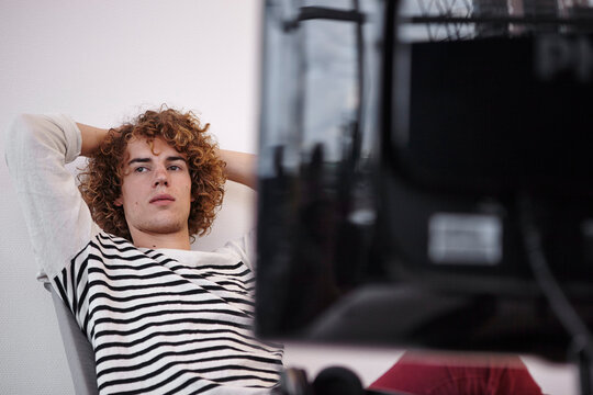 Young man in office thinking