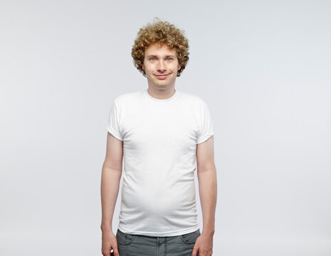 Portrait of smiling blond man wearing white t-shirt
