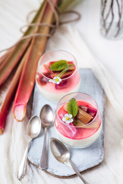 Glasses of Panna Cotta with roasted rhubarb