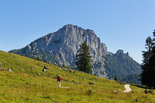 Austria, Upper Austria, Mature woman walking on Stubwieswipfel Mountain