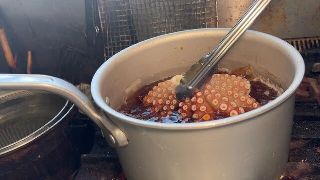 Whole Octopus in Soy Sauce Broth Turning Deep Red: Japanese Comfort Food (Tako Nimono) at an Izakaya