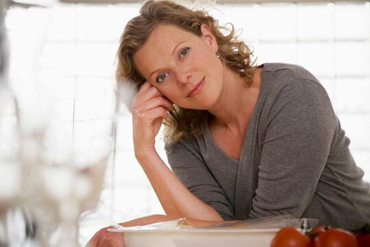 Woman in kitchen, portrait