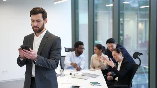 Group of employees whispering behind a coworker in office. Colleagues gossiping and mocking in the background of worker. Bullying and toxic workplace environment problem. Social exclusion and mobbing