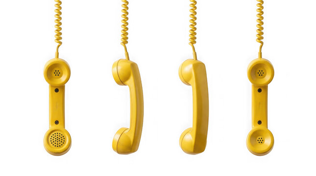 Four yellow vintage telephone handsets isolated on white background