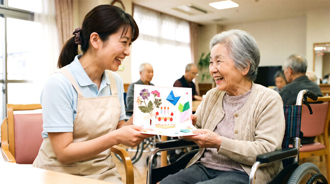 誕生日カードを渡すスタッフと利用者