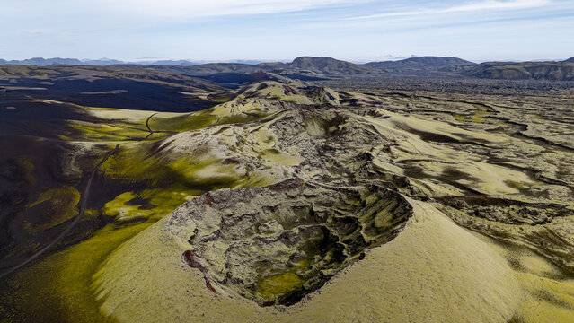 Aerial view of Laki volcanic craters surrounded by vast moss-covered lava fields and rugged terrain in Skaftarhreppur, Iceland.