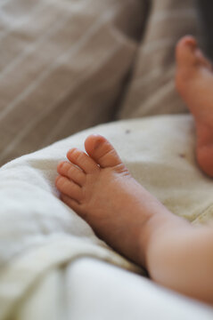 Newborn baby feet showing small toes and soft skin
