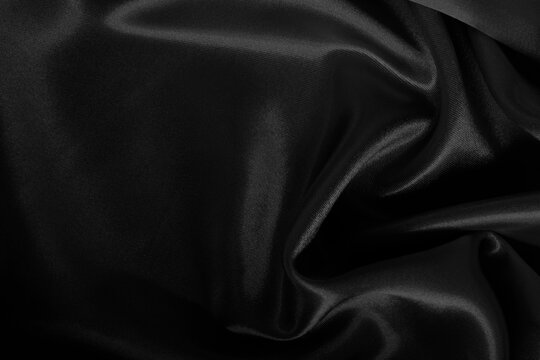 Black grey fabric texture background, detail of silk or linen pattern.