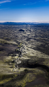 Aerial view of the volcanic Laki fissure stretching across moss-covered lava fields in the Icelandic highlands in Kirkjubaejarklaustur, Skaftarhreppur, Iceland.