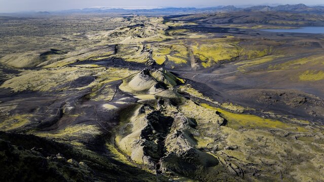 Aerial view of the Laki volcanic fissure with moss-covered lava fields and dark volcanic rock formations in the rugged landscape of Kirkjubaejarklaustur, Skaftarhreppur, Iceland.