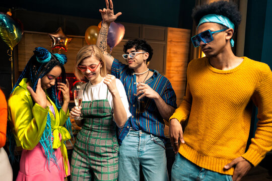Group of friends making party at home on new year evening