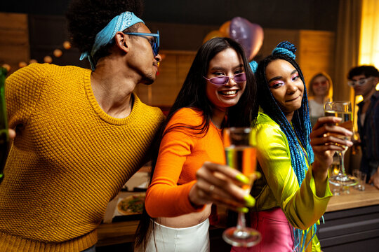 Group of friends making party at home on new year evening