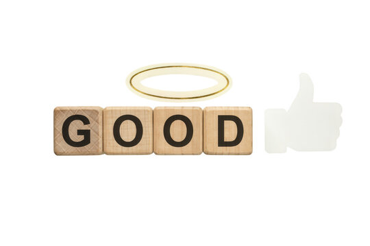 Wooden blocks spelling GOOD with halo and thumbs up icon, moral concept of goodness and virtue, ethical behavior and positive feedback