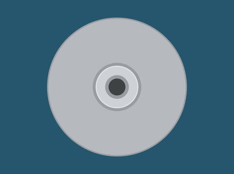Top view of a silver compact disc or DVD on blue background.