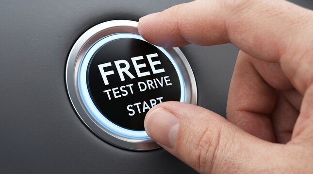 Hand Pressing Free Test Drive Start Button on Car Dashboard