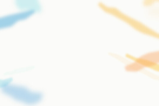 Soft abstract watercolor brush strokes in light blue and pale orange colors on a clean white background, artistic minimalist composition