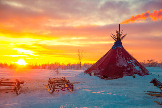Traditional dwelling of Nenets reindeer herders, chum, at sunset.