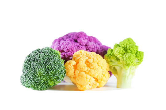 Fresh multicolored cauliflower isolated on a white background. Purple, green, and yellow florets.