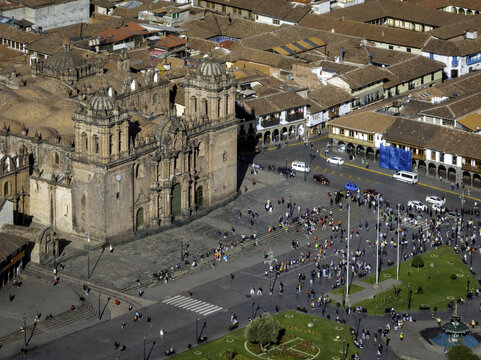 Aerial view of the historic Plaza de Armas and the Cusco Cathedral surrounded by colonial architecture and terracotta rooftops in Cusco, Cuzco, Peru.