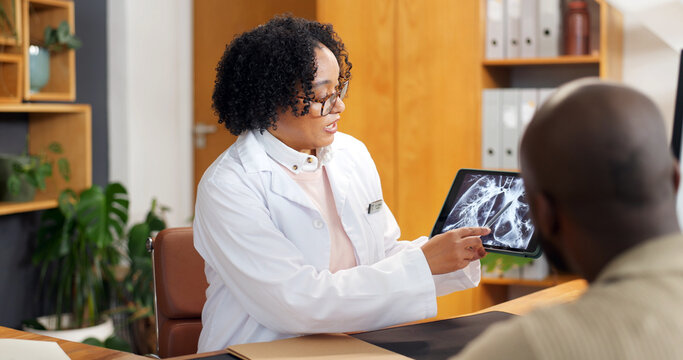 Consulting, tablet screen and xray with doctor of patient in office for feedback or MRI review. Advice, radiology and results with medical professional speaking to person in hospital for diagnosis