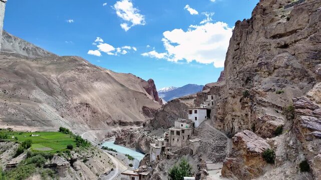 Zanskar, India : Tilt down footage of beautiful landscape and mountain road of Lungnak river and valley where Phuktal gompa, cliffside monastery built in natural cave of Zanskar in Ladakh, India surro