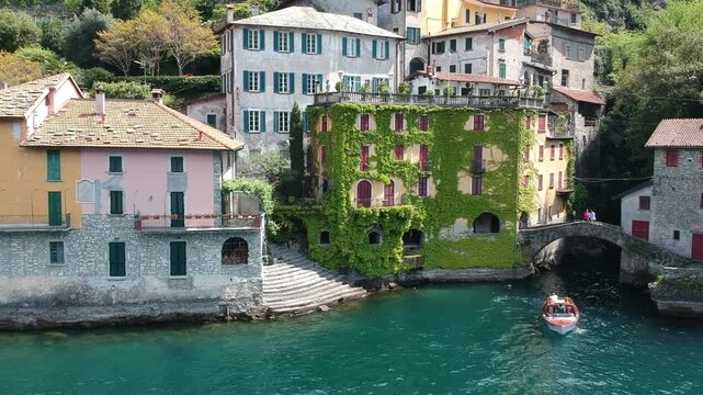 Orrido di Nesso waterfall on Lake Como, Italy, drone view with historic bridge and village