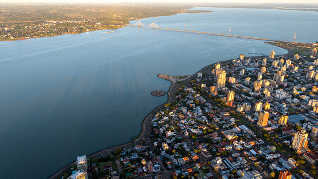 Aerial view of the International Bridge San Roque Gonzalez of Santa Cruz spanning the Parana River, with the urban skyline of Posadas in Posadas, Misiones Province, Argentina.