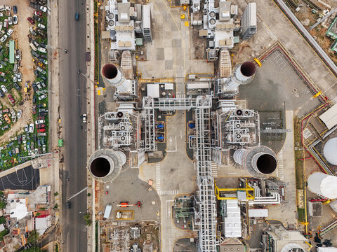 Aerial view of Parque Electrico Los Mina power plant featuring industrial machinery, cooling towers, and adjacent urban roads in Santo Domingo, Santo Domingo, Dominican Republic.