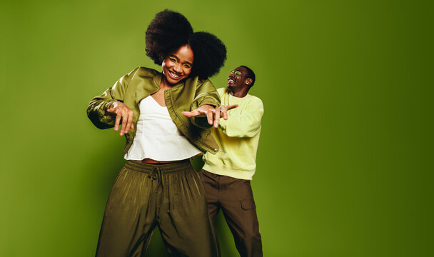 Urban friends dance together in the studio with joyful movement and lifestyle rhythm