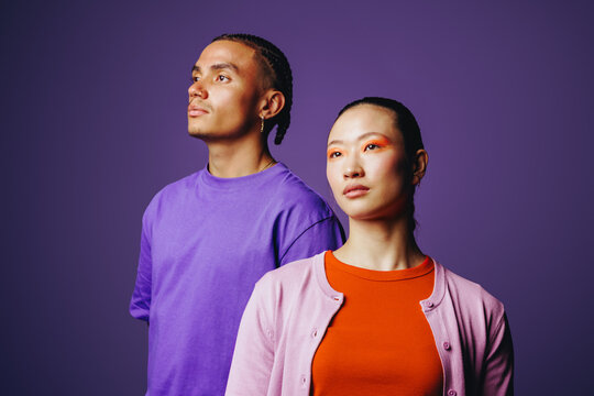 Friends portrait of young adults in studio with confident lifestyle style