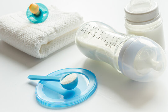 preparation of mixture baby feeding on white background