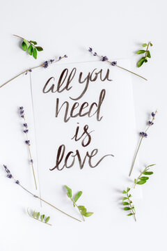 calligraphy floral pattern top view all you need is love