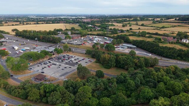 Aerial view of Welcome Break Corley Northbound Services M6 showing the motorway service area with parking lots and surrounding green fields in Coventry, England, United Kingdom.
